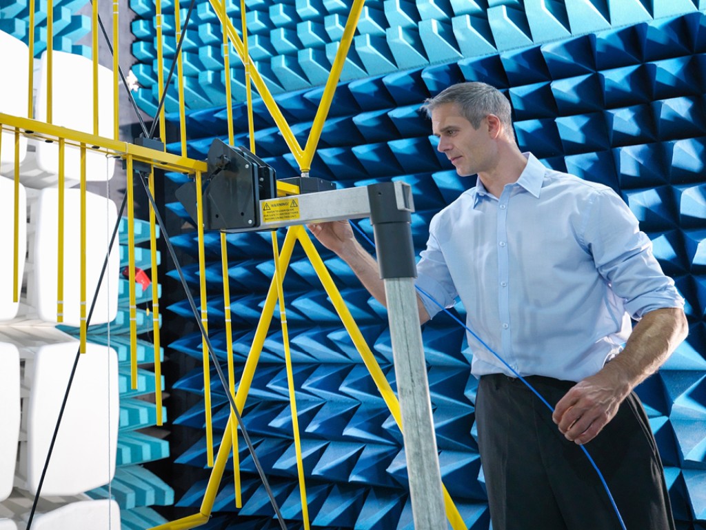 Test engineer in an EMC test chamber
