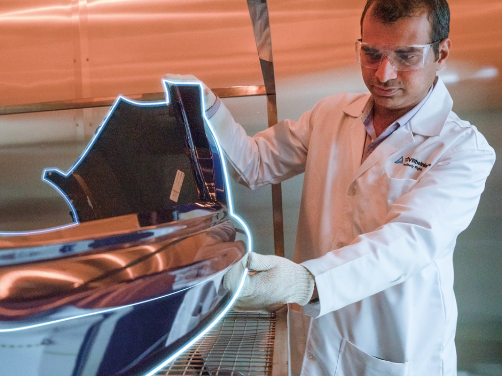 Person examining electromobility component 