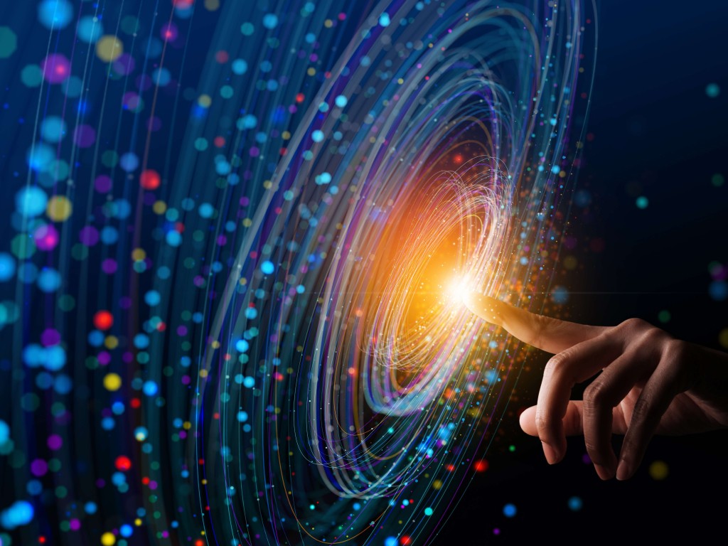 Hand touching a point of light 