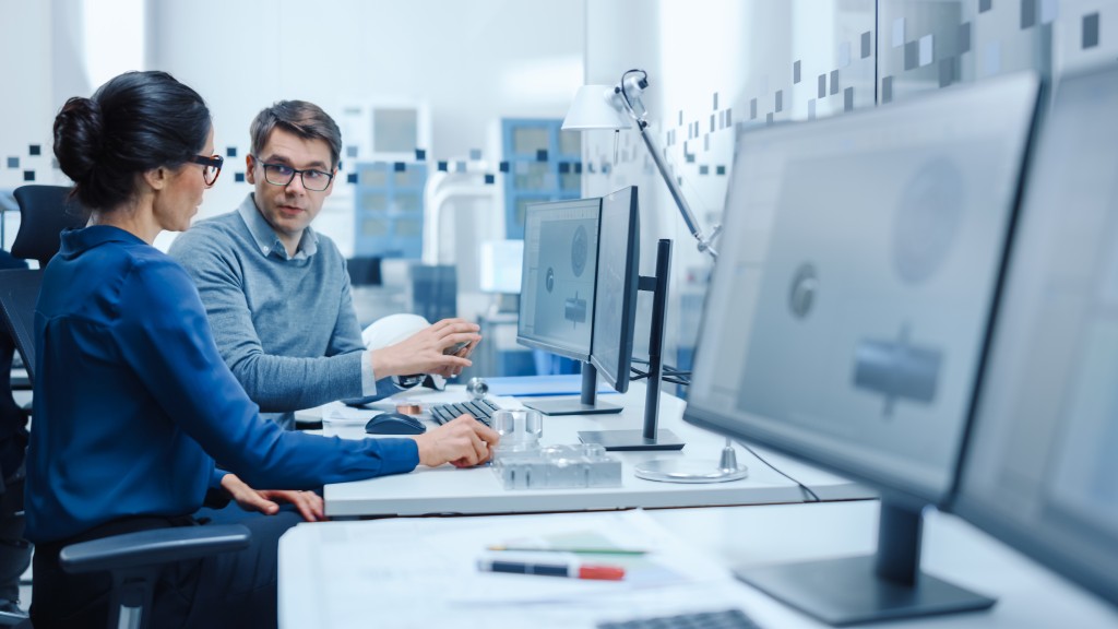 A man and a woman on a PC preparing a Declaration of Conformity. 